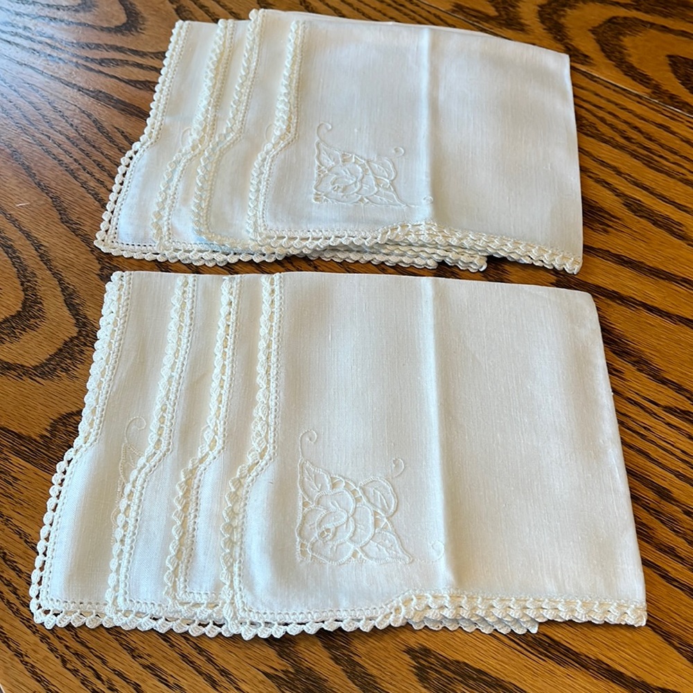 Cloth napkins with crocheted edge and cutout flower design